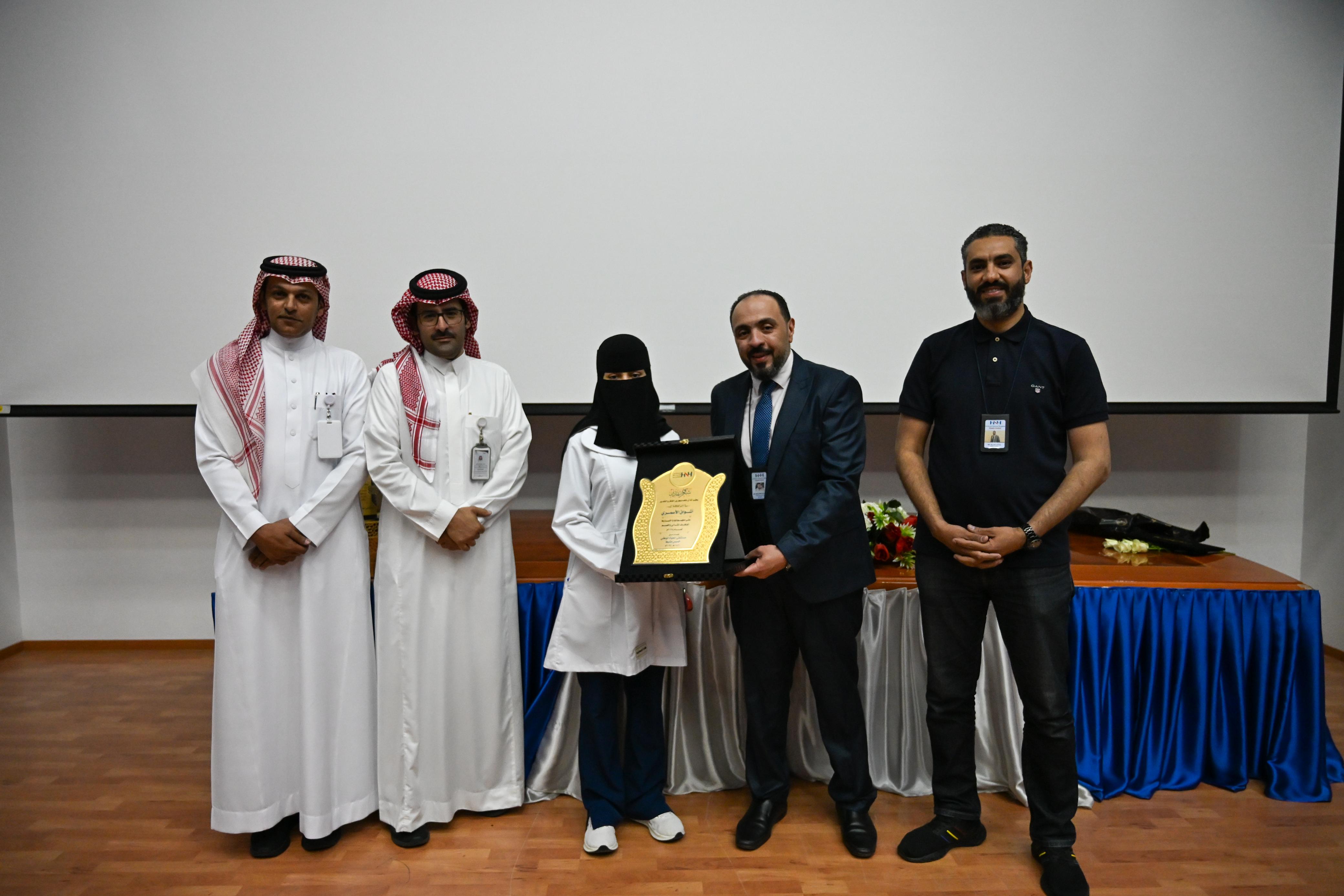 Dr. Mohamed Salama participating in a frontline staff recognition ceremony