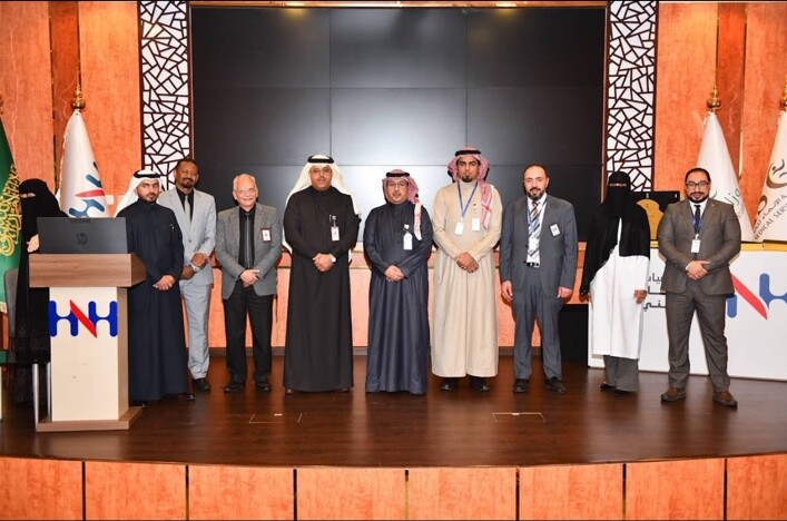 Dr. Mohamed Salama with healthcare leaders and professionals on stage at Hayat National Hospitals