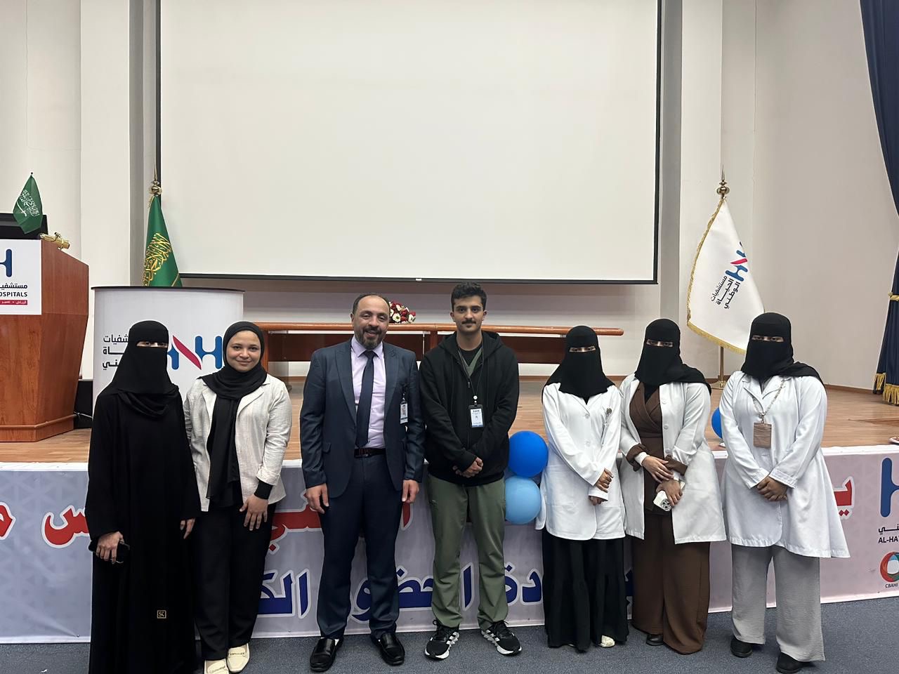 Dr. Mohamed Salama with IPC colleagues during a staff recognition event